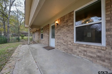 This lovely single-story home combines comfort, style, and on Hide-A-Way Lake Golf Course in Texas - for sale on GolfHomes.com, golf home, golf lot