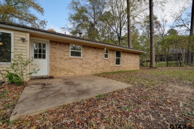 This lovely single-story home combines comfort, style, and on Hide-A-Way Lake Golf Course in Texas - for sale on GolfHomes.com, golf home, golf lot