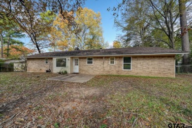 This lovely single-story home combines comfort, style, and on Hide-A-Way Lake Golf Course in Texas - for sale on GolfHomes.com, golf home, golf lot