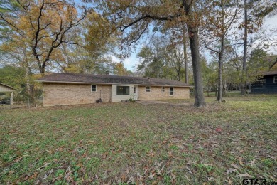 This lovely single-story home combines comfort, style, and on Hide-A-Way Lake Golf Course in Texas - for sale on GolfHomes.com, golf home, golf lot