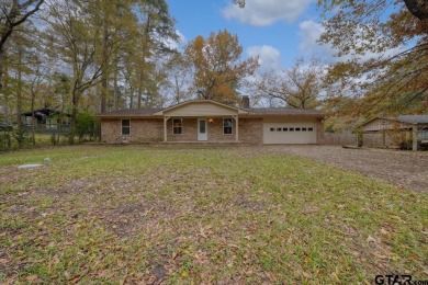 This lovely single-story home combines comfort, style, and on Hide-A-Way Lake Golf Course in Texas - for sale on GolfHomes.com, golf home, golf lot