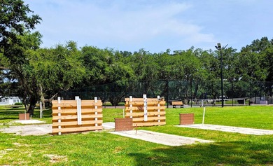 This spacious 3 bdrm,2 bath PALM HARBOR is completely furnished on Southport Springs Golf Club in Florida - for sale on GolfHomes.com, golf home, golf lot