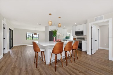 Modern Luxury Meets Beautiful Pond and Golf Course Views in This on Rotonda Golf and Country Club The Hills Course in Florida - for sale on GolfHomes.com, golf home, golf lot