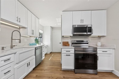 Modern Luxury Meets Beautiful Pond and Golf Course Views in This on Rotonda Golf and Country Club The Hills Course in Florida - for sale on GolfHomes.com, golf home, golf lot