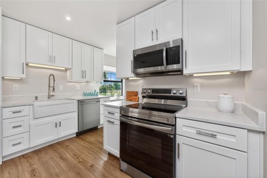 Modern Luxury Meets Beautiful Pond and Golf Course Views in This on Rotonda Golf and Country Club The Hills Course in Florida - for sale on GolfHomes.com, golf home, golf lot