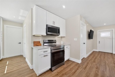 Modern Luxury Meets Beautiful Pond and Golf Course Views in This on Rotonda Golf and Country Club The Hills Course in Florida - for sale on GolfHomes.com, golf home, golf lot