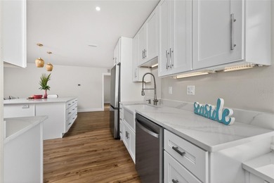 Modern Luxury Meets Beautiful Pond and Golf Course Views in This on Rotonda Golf and Country Club The Hills Course in Florida - for sale on GolfHomes.com, golf home, golf lot