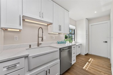 Modern Luxury Meets Beautiful Pond and Golf Course Views in This on Rotonda Golf and Country Club The Hills Course in Florida - for sale on GolfHomes.com, golf home, golf lot