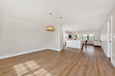 Modern Luxury Meets Beautiful Pond and Golf Course Views in This on Rotonda Golf and Country Club The Hills Course in Florida - for sale on GolfHomes.com, golf home, golf lot