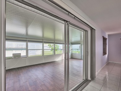 This is the largest 2/2/1 w/ the BONUS covered front porch on Leisureville Community Golf Course in Florida - for sale on GolfHomes.com, golf home, golf lot