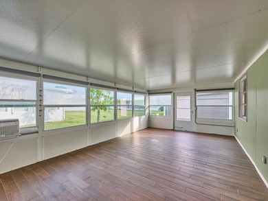 This is the largest 2/2/1 w/ the BONUS covered front porch on Leisureville Community Golf Course in Florida - for sale on GolfHomes.com, golf home, golf lot