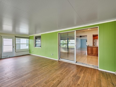 This is the largest 2/2/1 w/ the BONUS covered front porch on Leisureville Community Golf Course in Florida - for sale on GolfHomes.com, golf home, golf lot