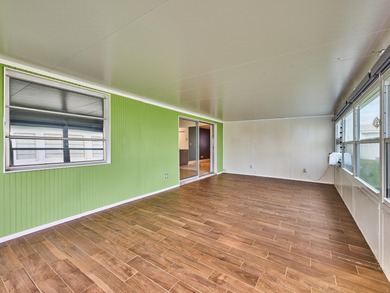 This is the largest 2/2/1 w/ the BONUS covered front porch on Leisureville Community Golf Course in Florida - for sale on GolfHomes.com, golf home, golf lot