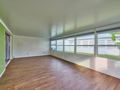 This is the largest 2/2/1 w/ the BONUS covered front porch on Leisureville Community Golf Course in Florida - for sale on GolfHomes.com, golf home, golf lot