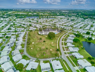 This is the largest 2/2/1 w/ the BONUS covered front porch on Leisureville Community Golf Course in Florida - for sale on GolfHomes.com, golf home, golf lot