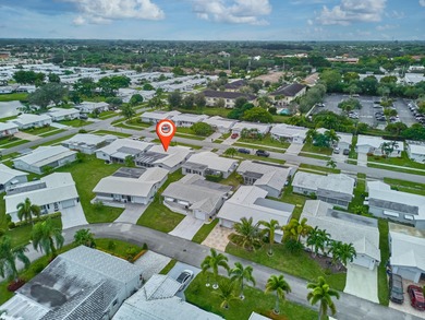 This is the largest 2/2/1 w/ the BONUS covered front porch on Leisureville Community Golf Course in Florida - for sale on GolfHomes.com, golf home, golf lot