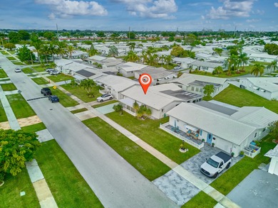 This is the largest 2/2/1 w/ the BONUS covered front porch on Leisureville Community Golf Course in Florida - for sale on GolfHomes.com, golf home, golf lot