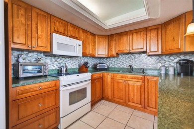 Enjoy convenience, privacy, and security in this light-filled on Belleair Country Club in Florida - for sale on GolfHomes.com, golf home, golf lot