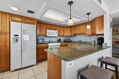 Enjoy convenience, privacy, and security in this light-filled on Belleair Country Club in Florida - for sale on GolfHomes.com, golf home, golf lot