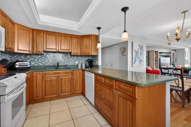 Enjoy convenience, privacy, and security in this light-filled on Belleair Country Club in Florida - for sale on GolfHomes.com, golf home, golf lot