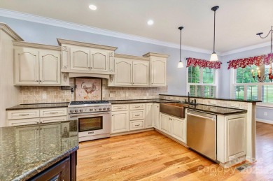 Enjoy beautiful water views of Lake Norman from this charming on Mallard Head Country Club in North Carolina - for sale on GolfHomes.com, golf home, golf lot