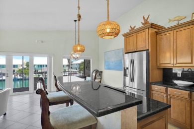 This well-maintained 2 Bedroom, 2 Bath elevated canal front half on Key Colony Beach Golf Course in Florida - for sale on GolfHomes.com, golf home, golf lot