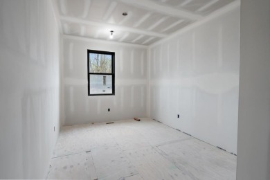 Experience elevated living at 809 Fairways Drive, located in The on Birchwood Farms Golf and Country Club in Michigan - for sale on GolfHomes.com, golf home, golf lot