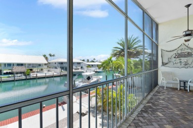 This well-maintained 2 Bedroom, 2 Bath elevated canal front half on Key Colony Beach Golf Course in Florida - for sale on GolfHomes.com, golf home, golf lot