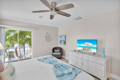 This well-maintained 2 Bedroom, 2 Bath elevated canal front half on Key Colony Beach Golf Course in Florida - for sale on GolfHomes.com, golf home, golf lot