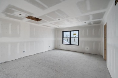 Experience elevated living at 809 Fairways Drive, located in The on Birchwood Farms Golf and Country Club in Michigan - for sale on GolfHomes.com, golf home, golf lot