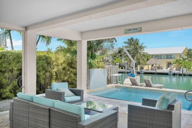 This well-maintained 2 Bedroom, 2 Bath elevated canal front half on Key Colony Beach Golf Course in Florida - for sale on GolfHomes.com, golf home, golf lot