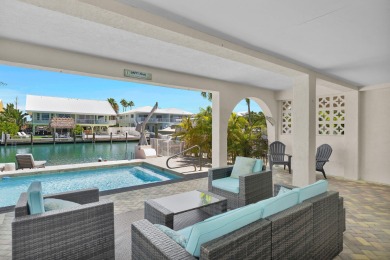 This well-maintained 2 Bedroom, 2 Bath elevated canal front half on Key Colony Beach Golf Course in Florida - for sale on GolfHomes.com, golf home, golf lot