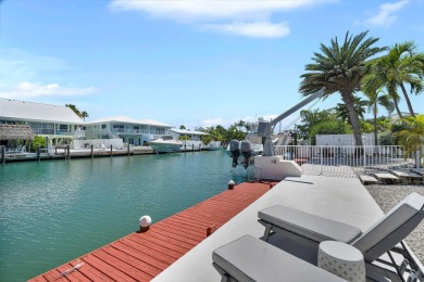 This well-maintained 2 Bedroom, 2 Bath elevated canal front half on Key Colony Beach Golf Course in Florida - for sale on GolfHomes.com, golf home, golf lot