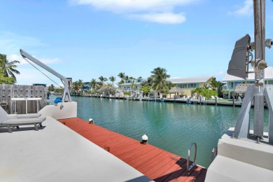 This well-maintained 2 Bedroom, 2 Bath elevated canal front half on Key Colony Beach Golf Course in Florida - for sale on GolfHomes.com, golf home, golf lot