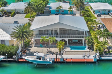 This well-maintained 2 Bedroom, 2 Bath elevated canal front half on Key Colony Beach Golf Course in Florida - for sale on GolfHomes.com, golf home, golf lot