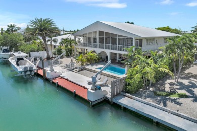 This well-maintained 2 Bedroom, 2 Bath elevated canal front half on Key Colony Beach Golf Course in Florida - for sale on GolfHomes.com, golf home, golf lot