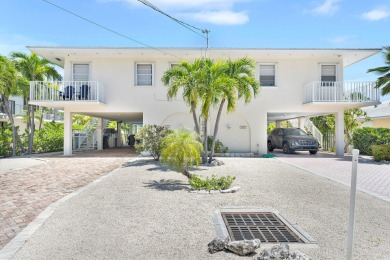 This well-maintained 2 Bedroom, 2 Bath elevated canal front half on Key Colony Beach Golf Course in Florida - for sale on GolfHomes.com, golf home, golf lot