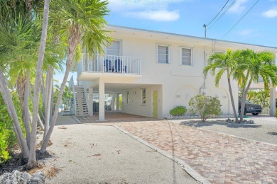 This well-maintained 2 Bedroom, 2 Bath elevated canal front half on Key Colony Beach Golf Course in Florida - for sale on GolfHomes.com, golf home, golf lot