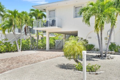 This well-maintained 2 Bedroom, 2 Bath elevated canal front half on Key Colony Beach Golf Course in Florida - for sale on GolfHomes.com, golf home, golf lot