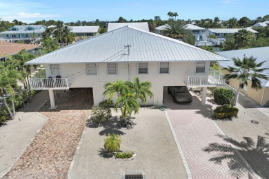 This well-maintained 2 Bedroom, 2 Bath elevated canal front half on Key Colony Beach Golf Course in Florida - for sale on GolfHomes.com, golf home, golf lot