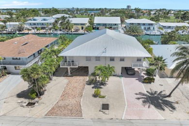 This well-maintained 2 Bedroom, 2 Bath elevated canal front half on Key Colony Beach Golf Course in Florida - for sale on GolfHomes.com, golf home, golf lot