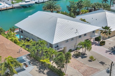 This well-maintained 2 Bedroom, 2 Bath elevated canal front half on Key Colony Beach Golf Course in Florida - for sale on GolfHomes.com, golf home, golf lot
