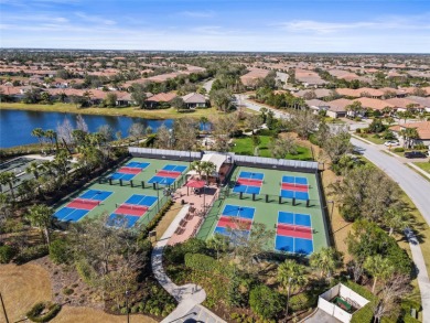 Experience resort-style living every day in this beautifully on Esplanade Golf and Country at Lakewood Ranch in Florida - for sale on GolfHomes.com, golf home, golf lot