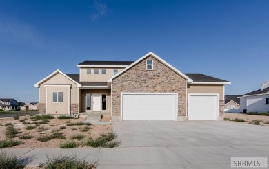 Situated on 0.29 acres, its brand-new faade exudes modern on Sage Lakes Municipal Golf Course in Idaho - for sale on GolfHomes.com, golf home, golf lot