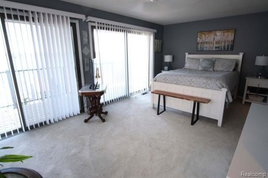 This stunning and spacious end unit condominium with premium on St Clair River Country Club in Michigan - for sale on GolfHomes.com, golf home, golf lot