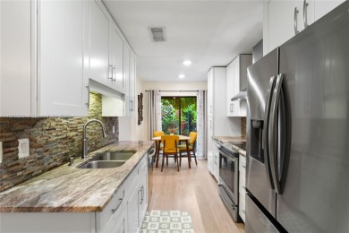 Beautifully updated 1,426 sqft two-story townhouse in the on Boca Lago Golf and Country Club in Florida - for sale on GolfHomes.com, golf home, golf lot