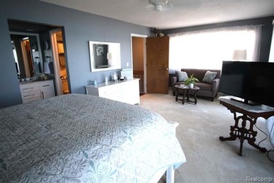 This stunning and spacious end unit condominium with premium on St Clair River Country Club in Michigan - for sale on GolfHomes.com, golf home, golf lot