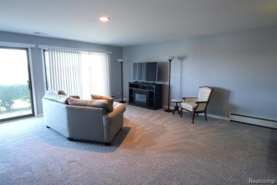 This stunning and spacious end unit condominium with premium on St Clair River Country Club in Michigan - for sale on GolfHomes.com, golf home, golf lot