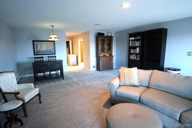 This stunning and spacious end unit condominium with premium on St Clair River Country Club in Michigan - for sale on GolfHomes.com, golf home, golf lot