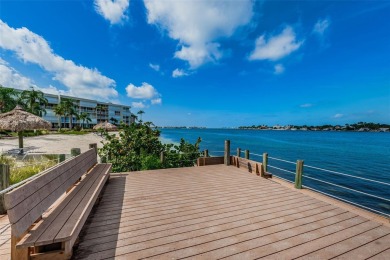 MILLION DOLLAR VIEW.. PRIVATE COMMUNITY BEACH.. FULLY UPDATED on Isla Del Sol Yacht and Country Club in Florida - for sale on GolfHomes.com, golf home, golf lot